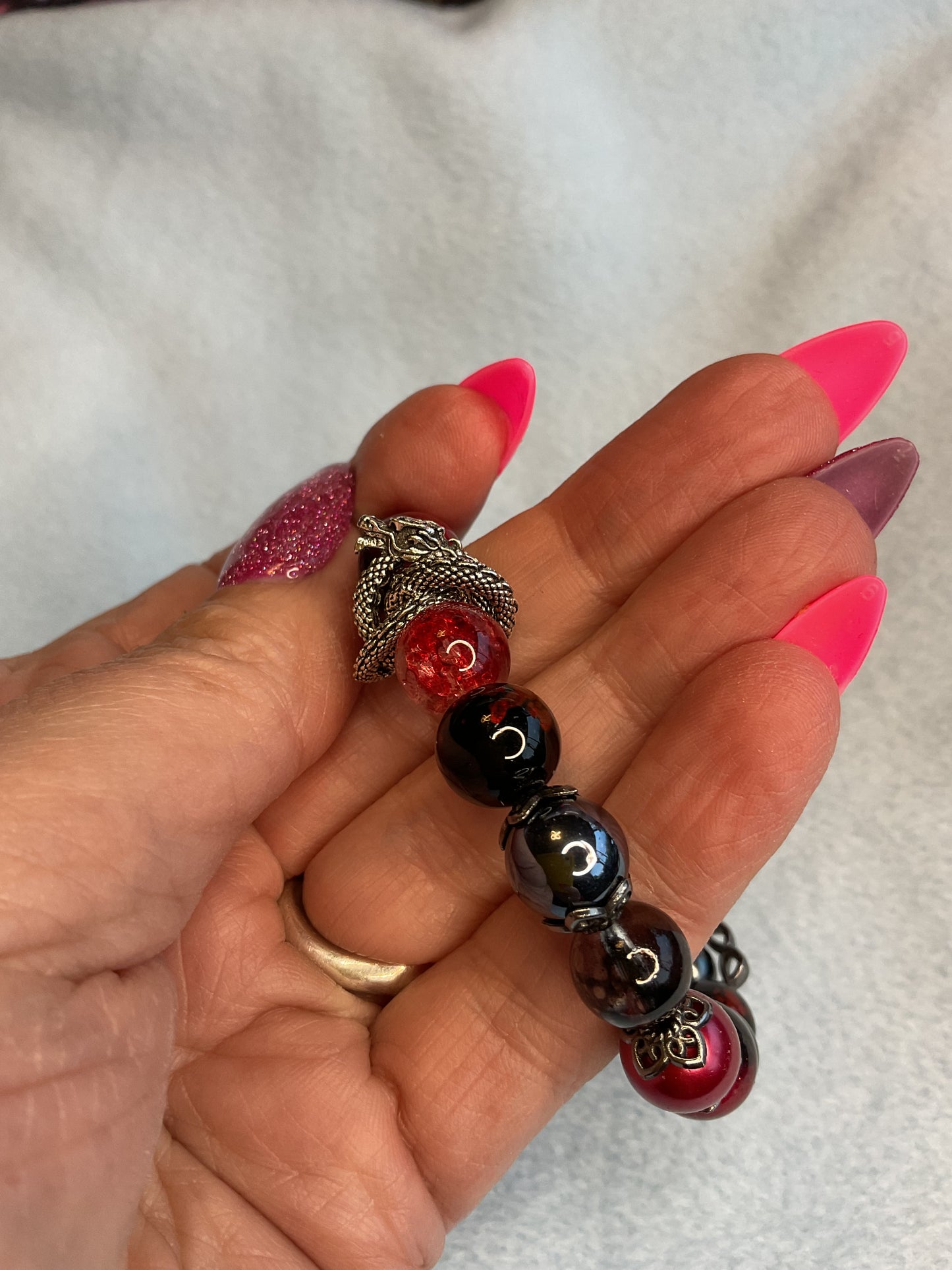 Bracelet with dragon swirl charm spacers