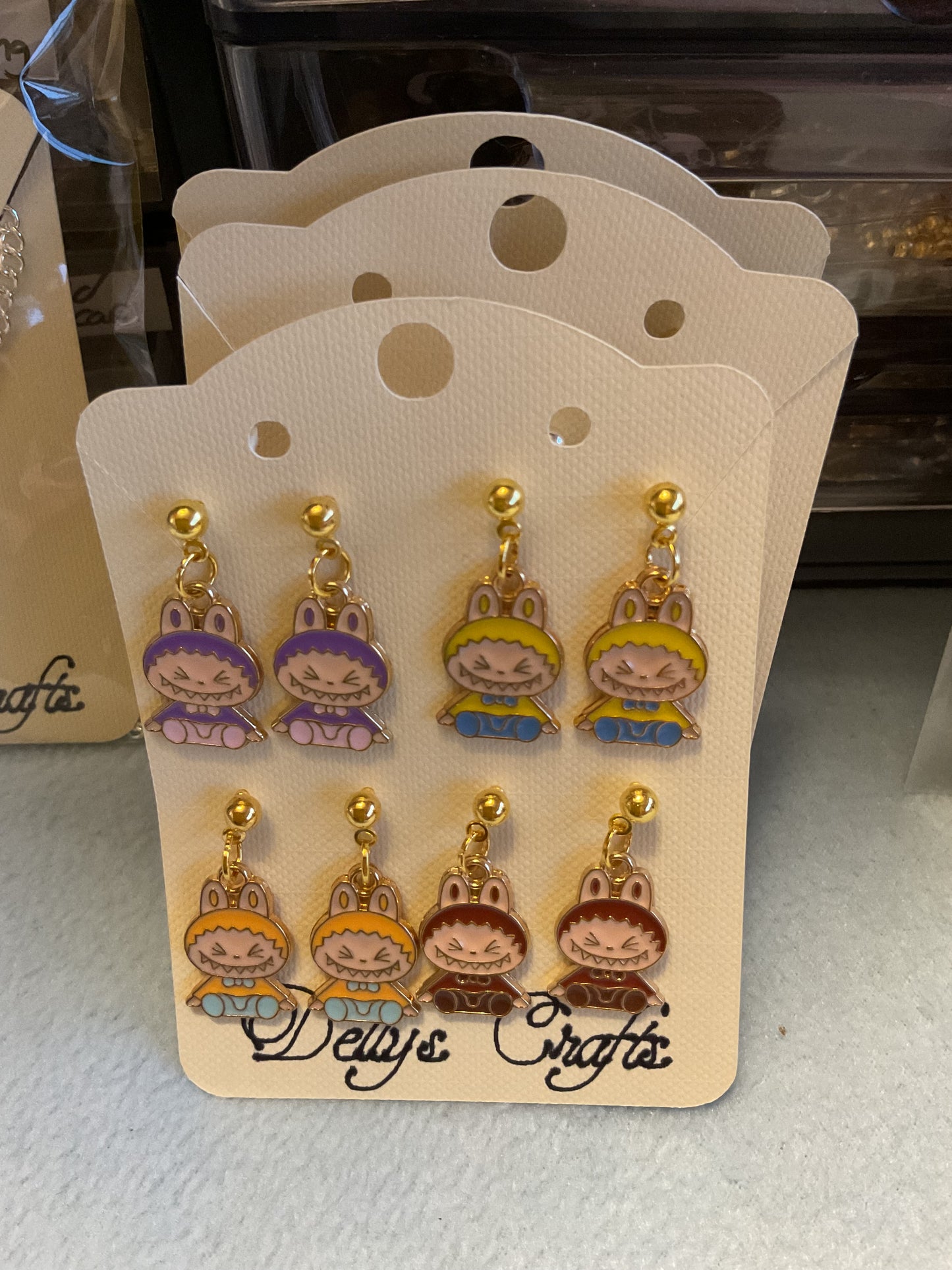 Sitting Labubu stud earrings