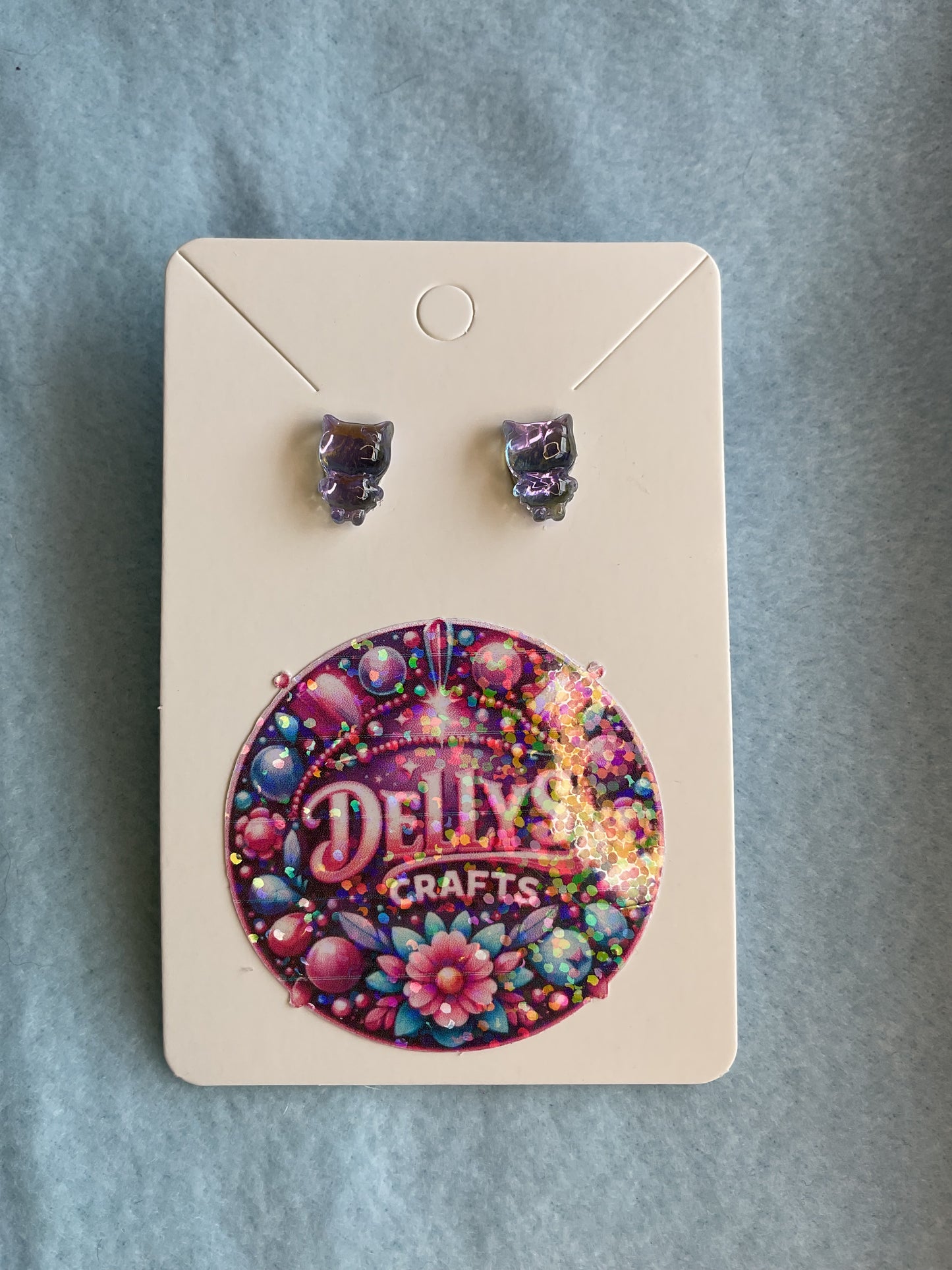 Glass shaped purple tint earrings