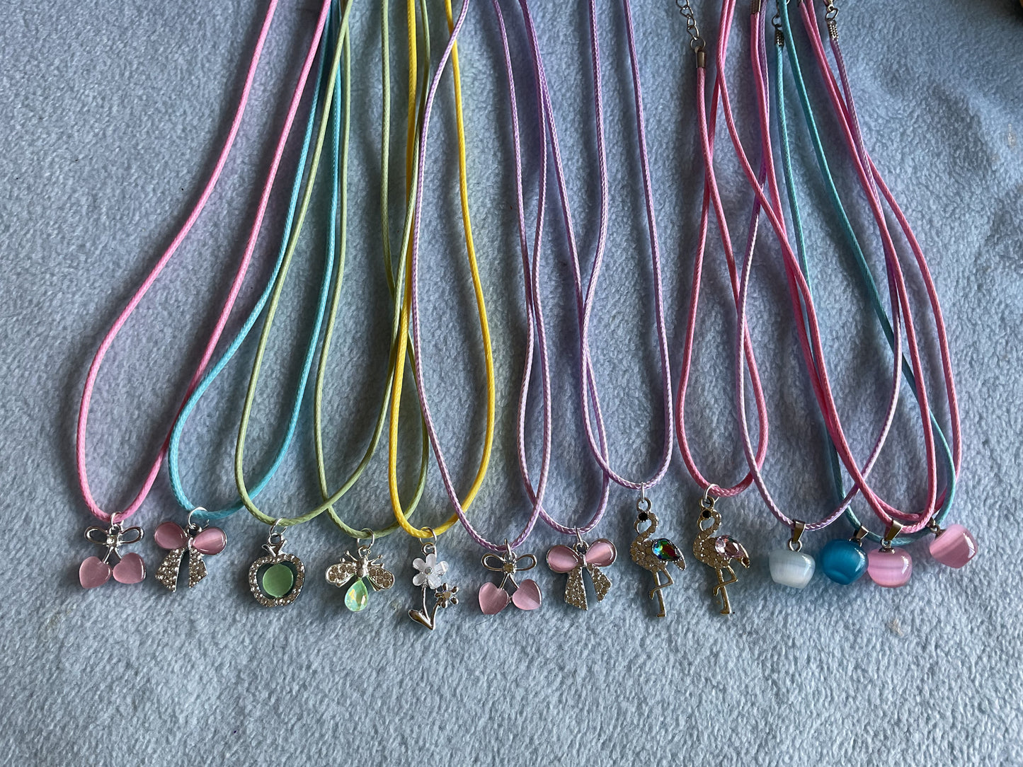 Corded necklace with cats eye charm or diamanté charm