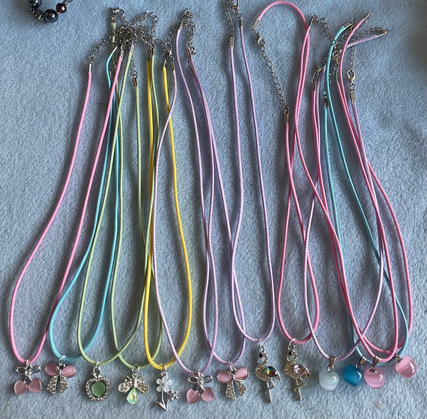 Corded necklace with cats eye charm or diamanté charm