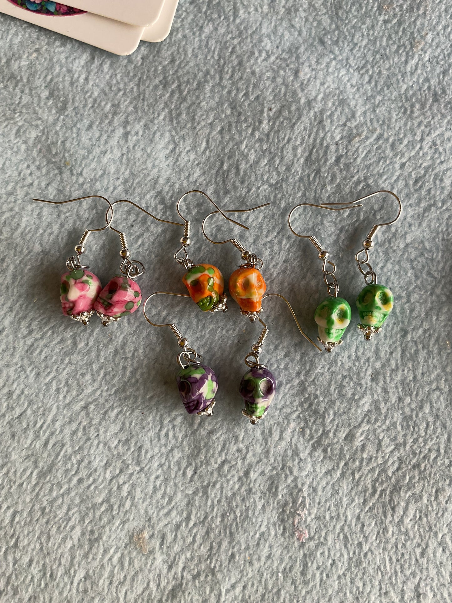 Orca jasper skull earrings