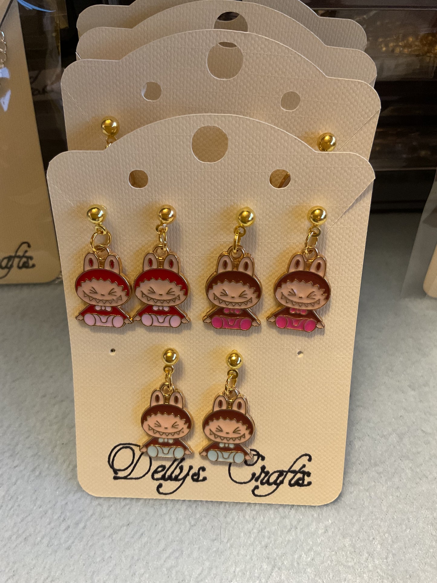 Sitting Labubu stud earrings